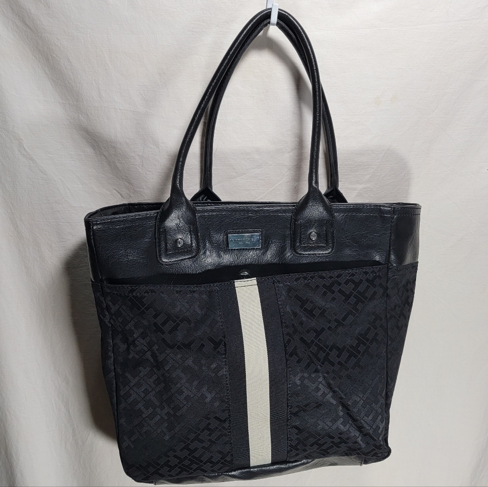 Tommy Hilfiger black Tote covered in T & H  and a white stripe in great shape.